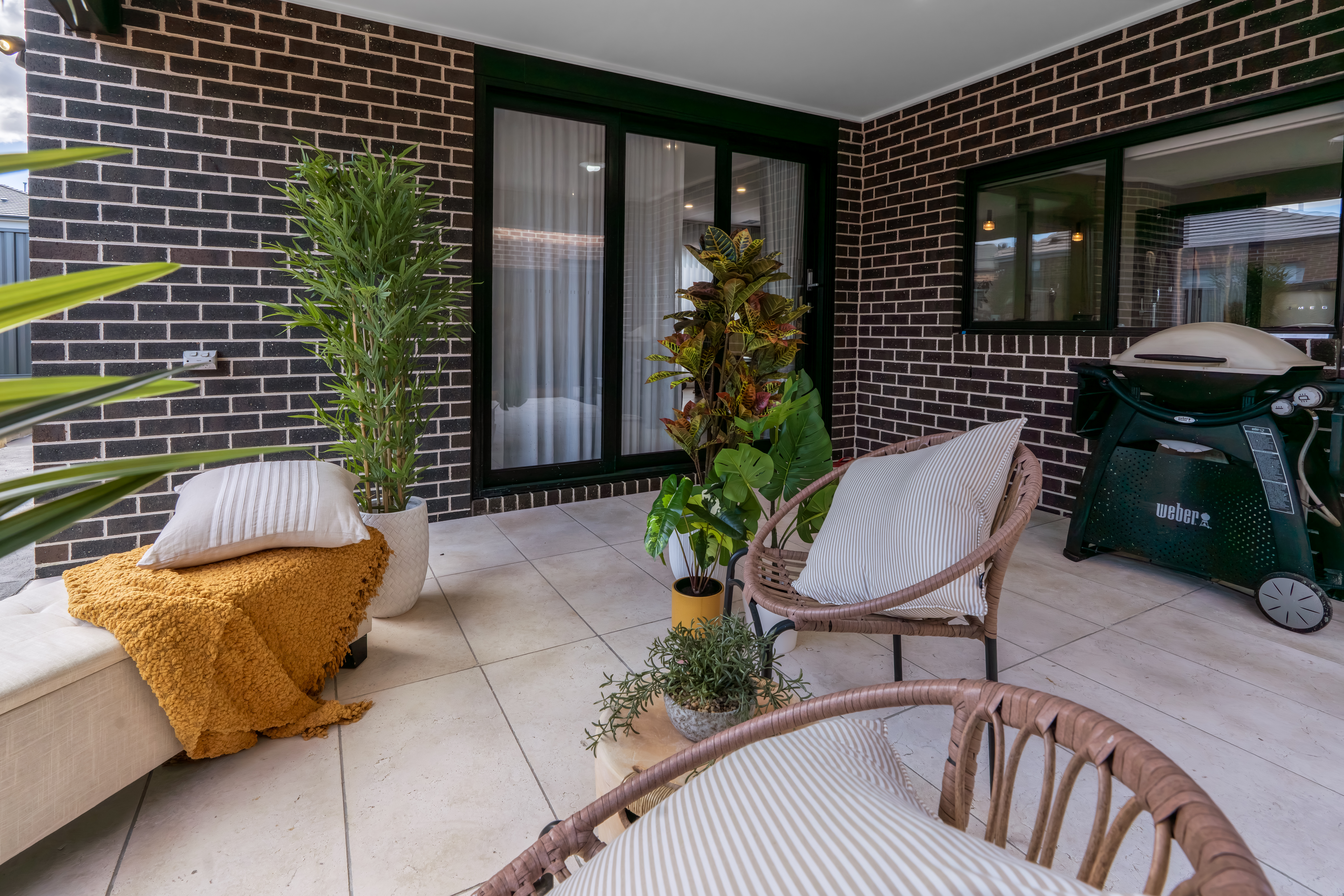 Styled living space with neutral palette and soft pink accents